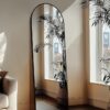 Standing black arched full body mirror with sleek aluminum frame