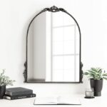 black arched wall mirror with metal frame