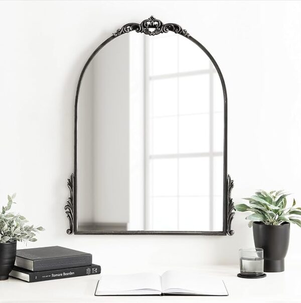 black arched wall mirror with metal frame