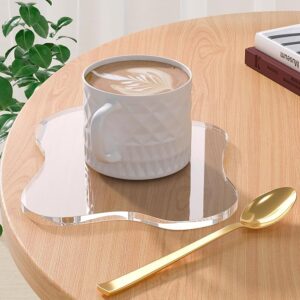 Clear irregular acrylic mirror coasters on modern coffee table