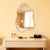 Frameless asymmetrical wall mirror bathroom mounted above modern vanity