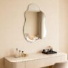 Irregular frameless wall mirror for contemporary bathroom interior