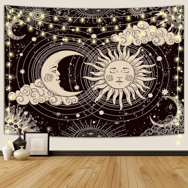 Black sun and moon tapestry hanging on bedroom wall with aesthetic dark decor